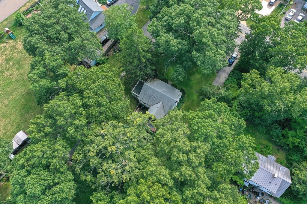 553 Winter Street Walpole, MA 02081 - Photo 12 of 42 an aerial view of a house with a yard and tree s