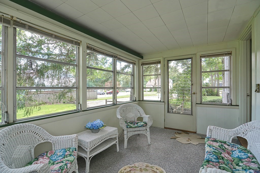 553 Winter Street Walpole, MA 02081 - Photo 16 of 42 a living room with furniture and a window