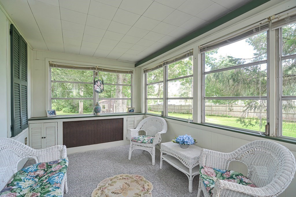 553 Winter Street Walpole, MA 02081 - Photo 17 of 42 a living room with furniture and a large window