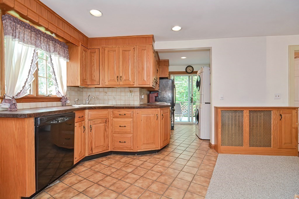 553 Winter Street Walpole, MA 02081 - Photo 20 of 42 a kitchen with stainless steel appliances granite countertop a sink a stove and a refrigerator