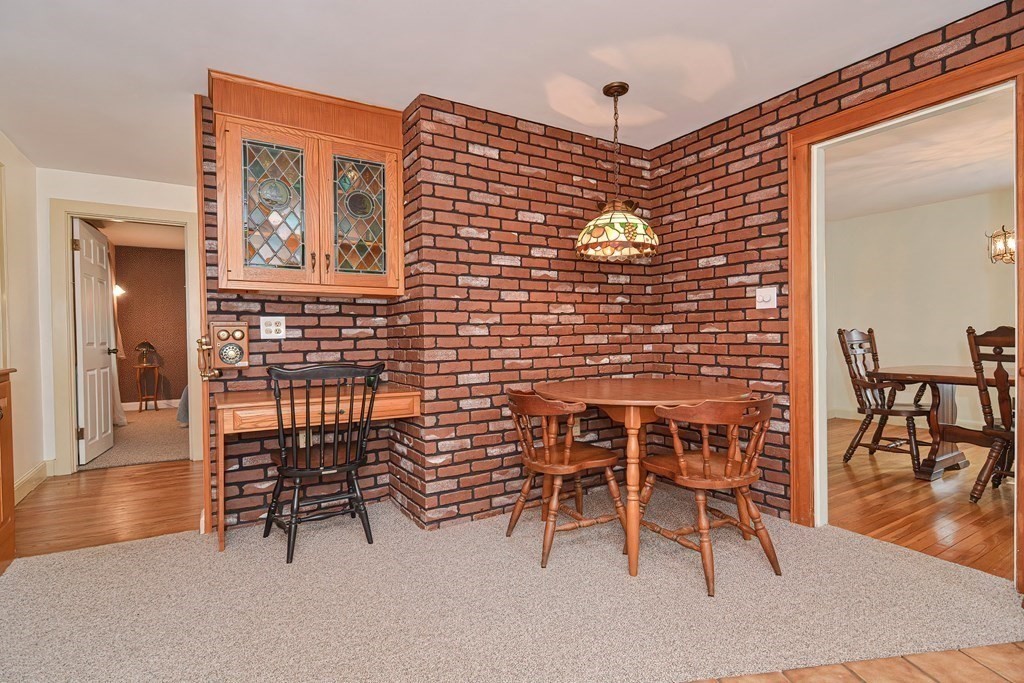553 Winter Street Walpole, MA 02081 - Photo 23 of 42 a dining room with furniture and wooden floor