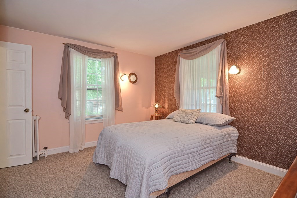 553 Winter Street Walpole, MA 02081 - Photo 26 of 42 a bedroom with a bed and a window