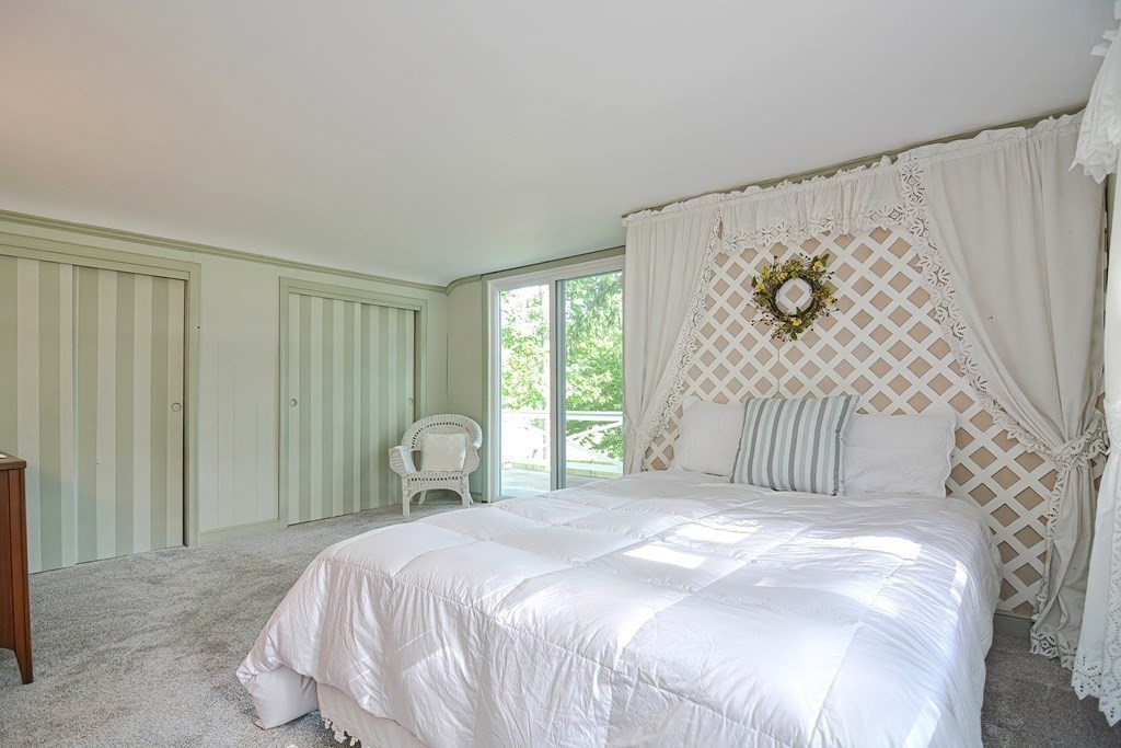 553 Winter Street Walpole, MA 02081 - Photo 29 of 42 a bedroom with a bed and a window