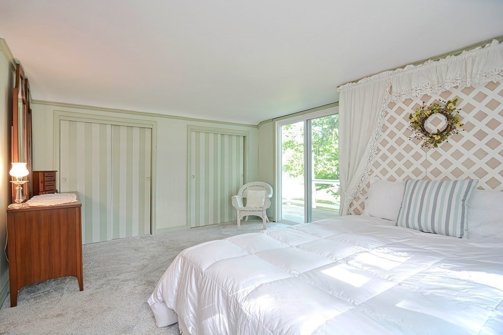 553 Winter Street Walpole, MA 02081 - Photo 30 of 42 a bedroom with a bed and a window