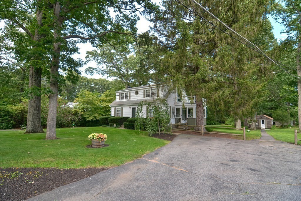 553 Winter Street Walpole, MA 02081 - Photo 3 of 42 a front view of a house with garden
