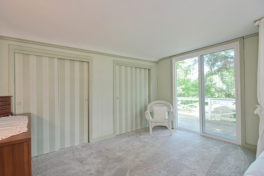 553 Winter Street Walpole, MA 02081 - Photo 31 of 42 a view of a room with a window and a chair