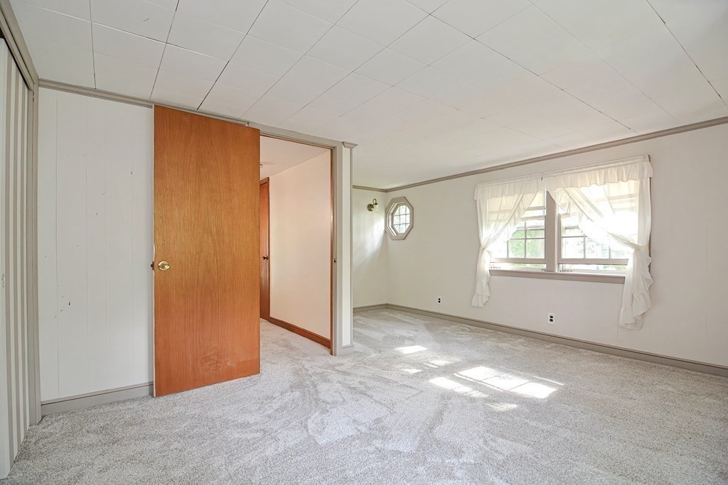 553 Winter Street Walpole, MA 02081 - Photo 33 of 42 an empty room with windows and closet