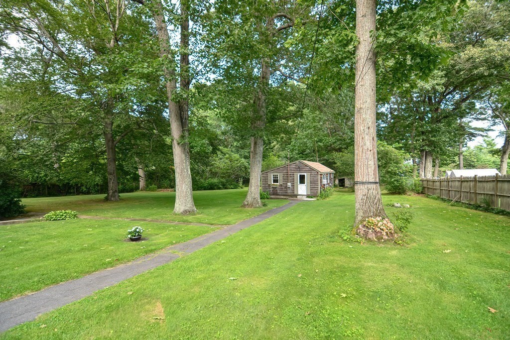 553 Winter Street Walpole, MA 02081 - Photo 35 of 42 a front view of a house with garden