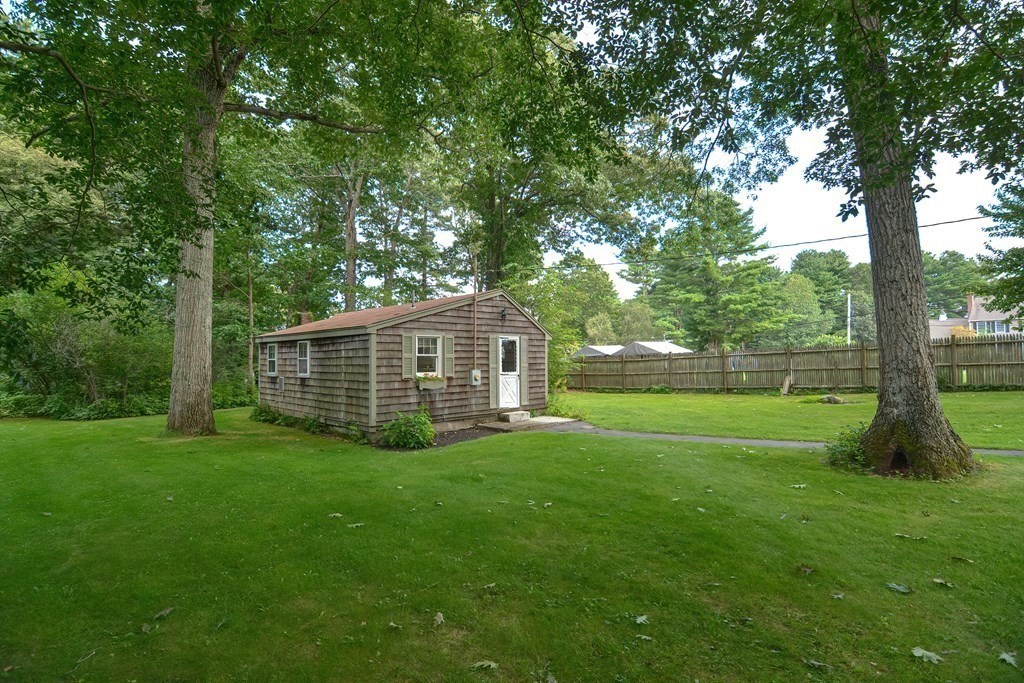 553 Winter Street Walpole, MA 02081 - Photo 36 of 42 a view of a big yard with large trees