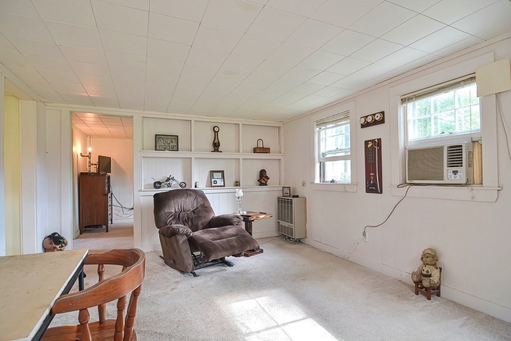 553 Winter Street Walpole, MA 02081 - Photo 37 of 42 a living room with furniture and a window