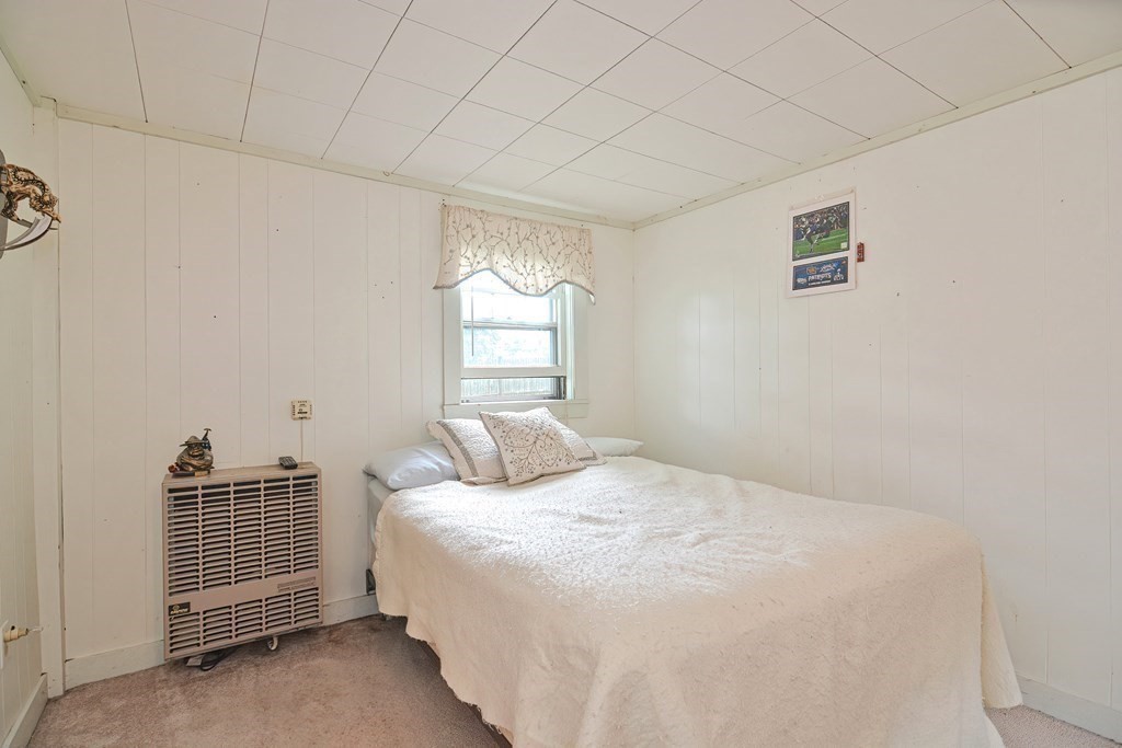 553 Winter Street Walpole, MA 02081 - Photo 40 of 42 a bedroom with a bed and a window