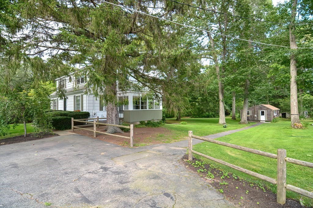 553 Winter Street Walpole, MA 02081 - Photo 6 of 42 a view of a house with backyard porch and sitting area