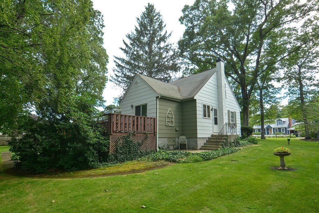 553 Winter Street Walpole, MA 02081 - Photo 8 of 42 a front view of house with yard and green space
