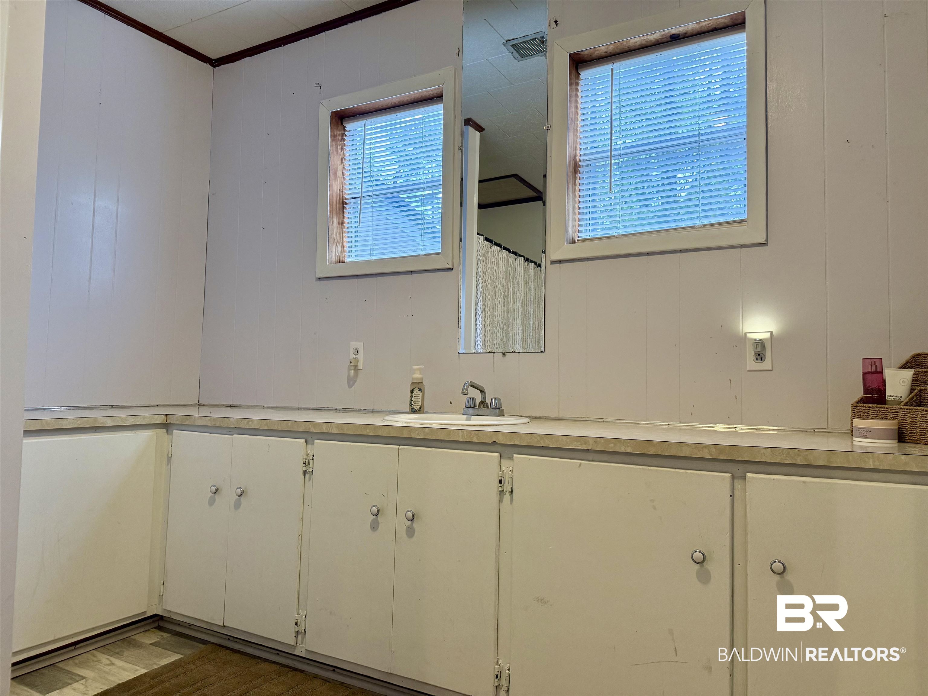 826 West Side Road Castleberry, AL 36432 - Photo 22 of 34 Full bath featuring vanity and dark wood-type flooring
