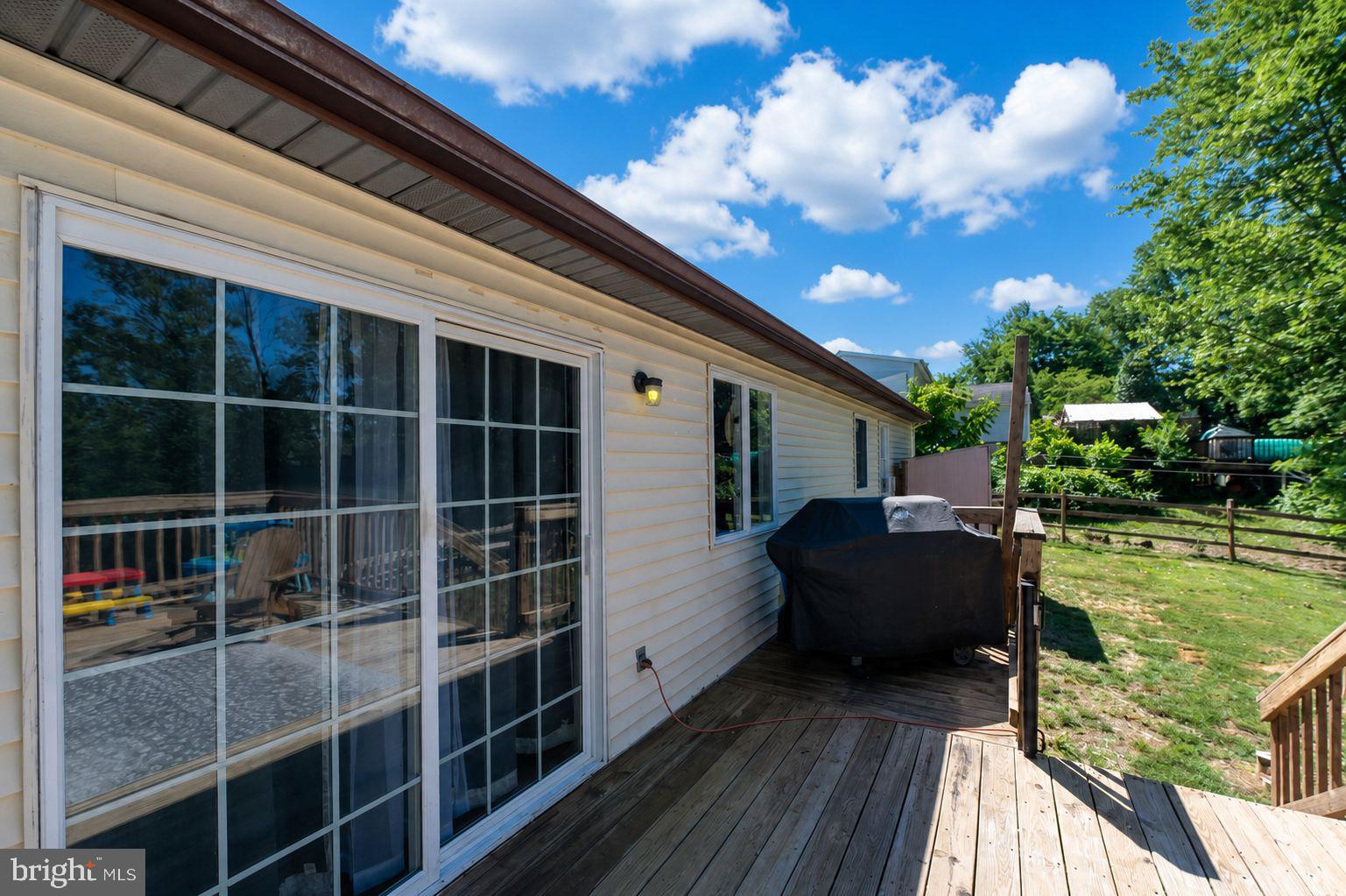 182 Rose Valley Road Pottstown, PA 19464 - Photo 5 of 52 Sunny deck with serene backyard views.