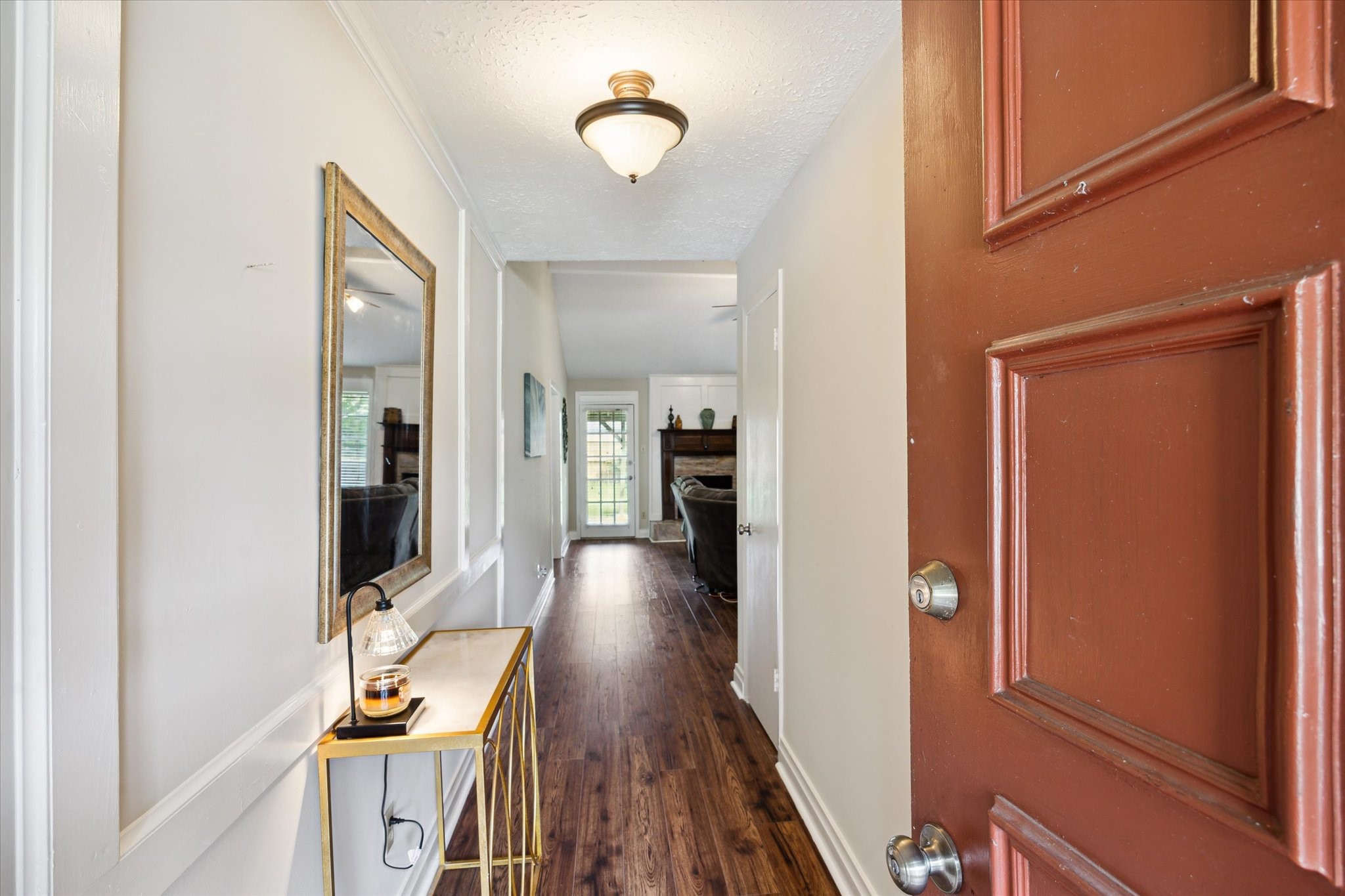 4226 Mossygate Drive Spring, TX 77373 - Photo 4 of 16 a view of a hallway with wooden floor fireplace and living room