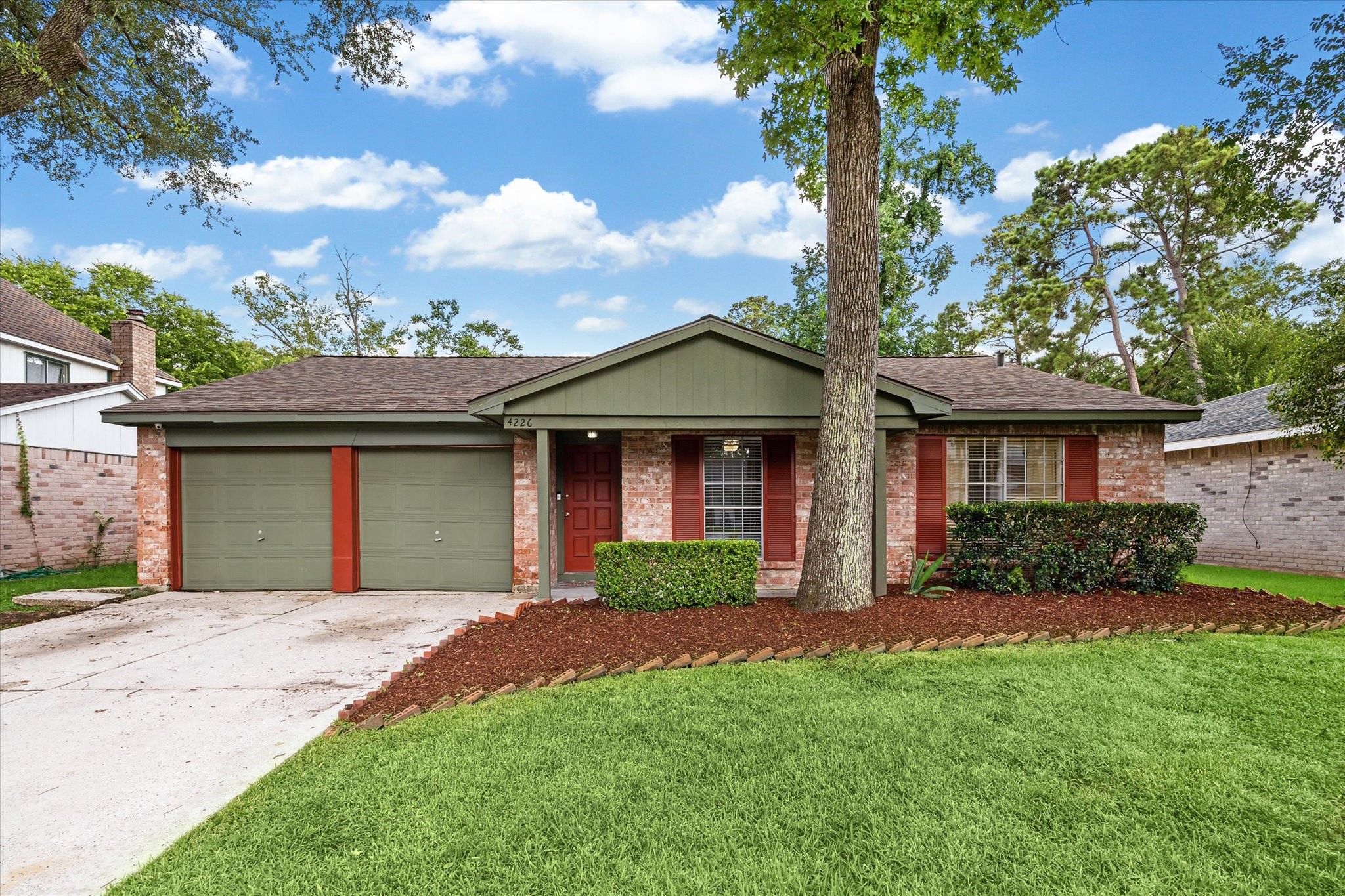 4226 Mossygate Drive Spring, TX 77373 - Photo 6 of 16 a front view of a house with a garden and yard
