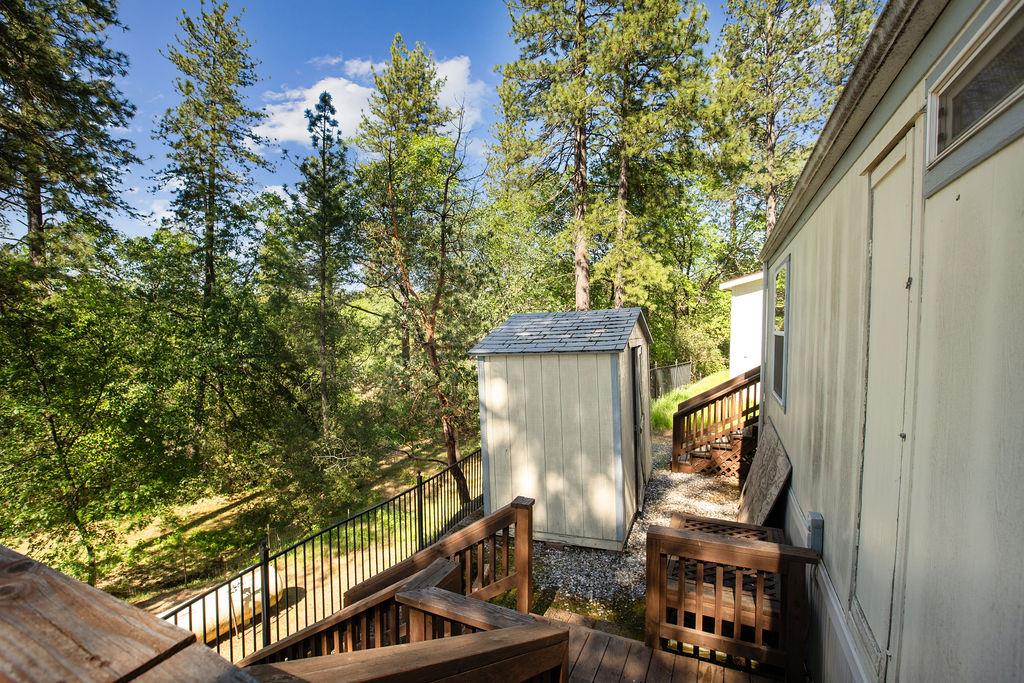 1281 Pleasant Valley Road, Unit 44 Diamond Springs, CA 95619 - Photo 26 of 27 a view of balcony with wooden floor and fence
