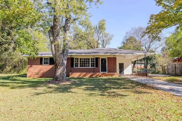 a front view of a house with a yard