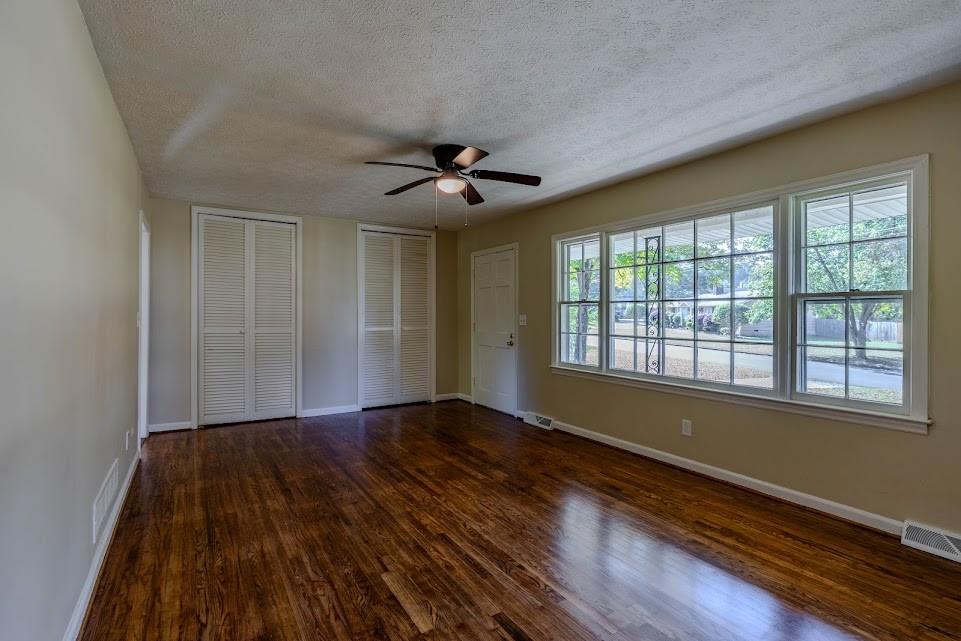 102 Beech Creek Drive Northwest Rome, GA 30165 - Photo 3 of 11 a view of empty room with wooden floor and fan