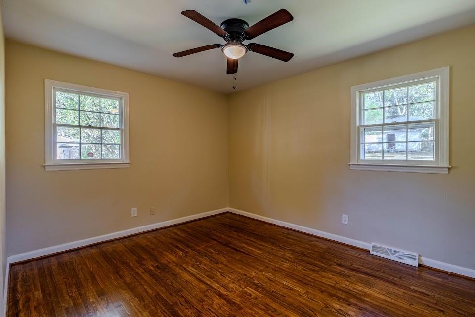 102 Beech Creek Drive Northwest Rome, GA 30165 - Photo 9 of 11 a view of a room with wooden floor and chandelier fan