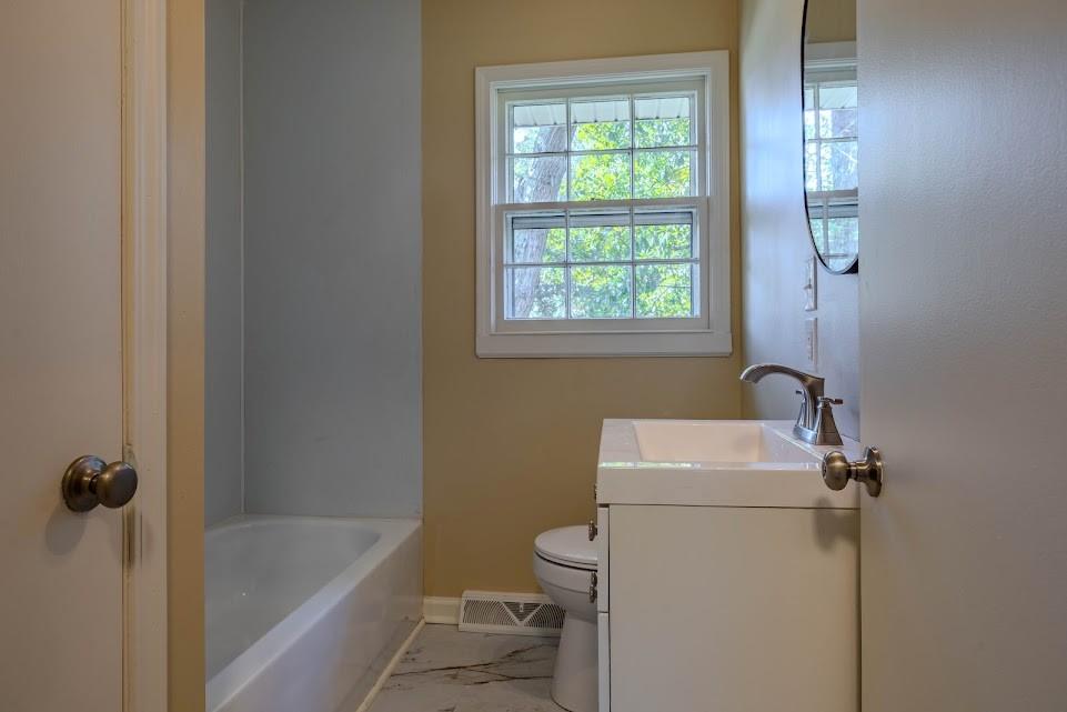 102 Beech Creek Drive Northwest Rome, GA 30165 - Photo 10 of 11 a bathroom with a sink a toilet and shower