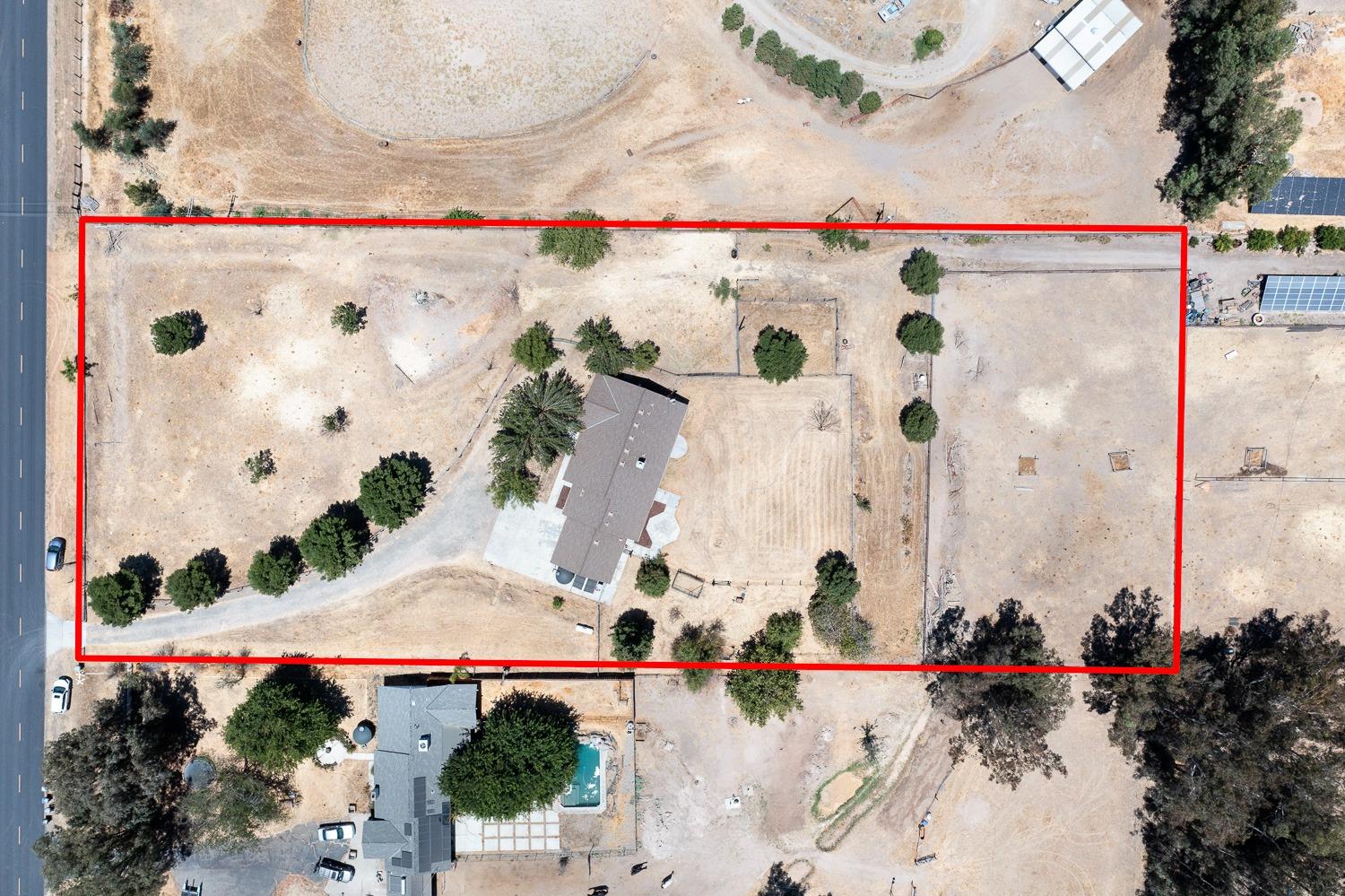 16787 Monreal Road Madera, CA 93636 - Photo 28 of 35 an aerial view of a multi story residential apartment building with outdoor space