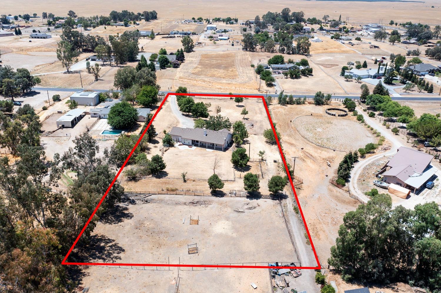16787 Monreal Road Madera, CA 93636 - Photo 29 of 35 an aerial view of a house with a yard and lake view