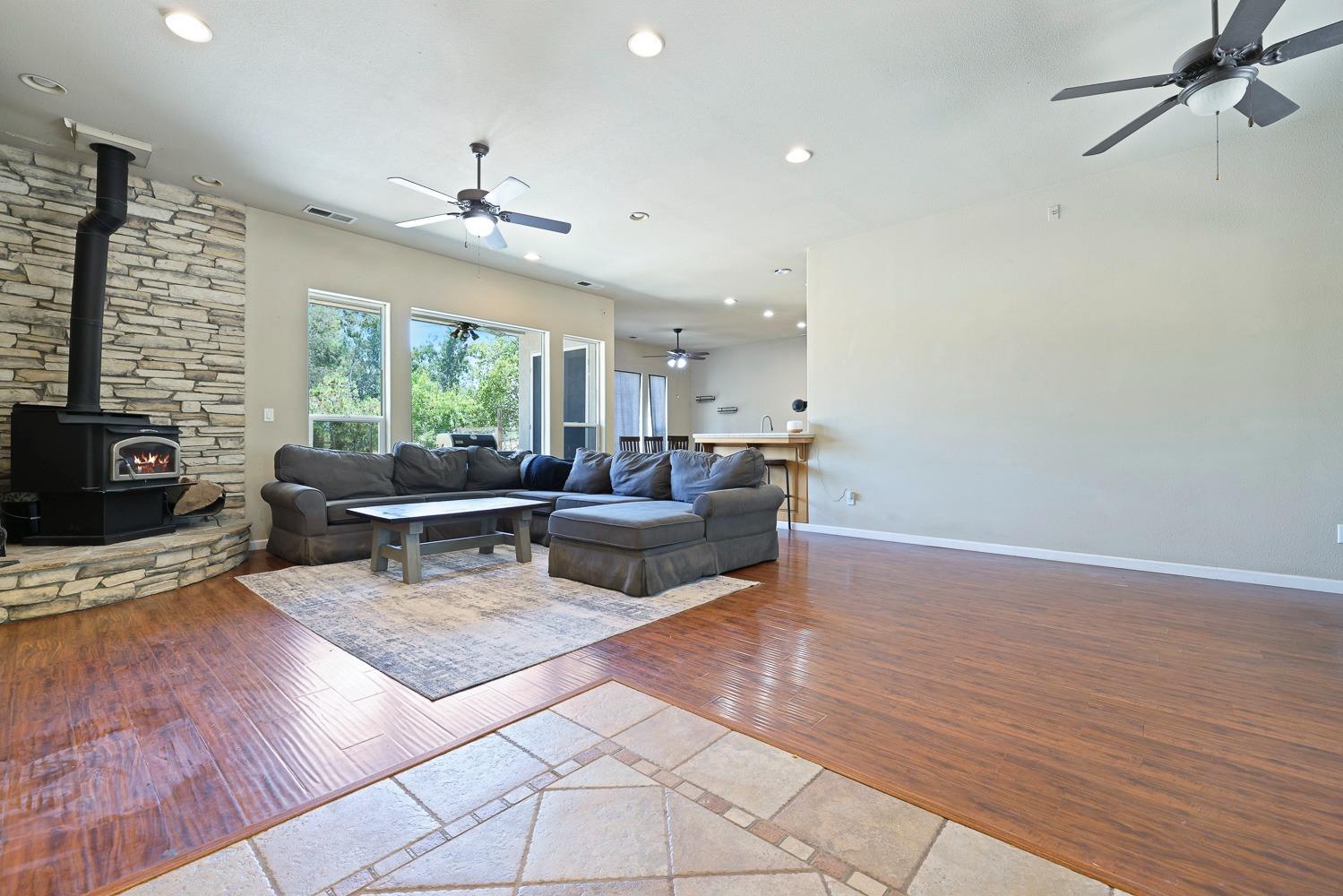 16787 Monreal Road Madera, CA 93636 - Photo 5 of 35 a living room with furniture and a fireplace
