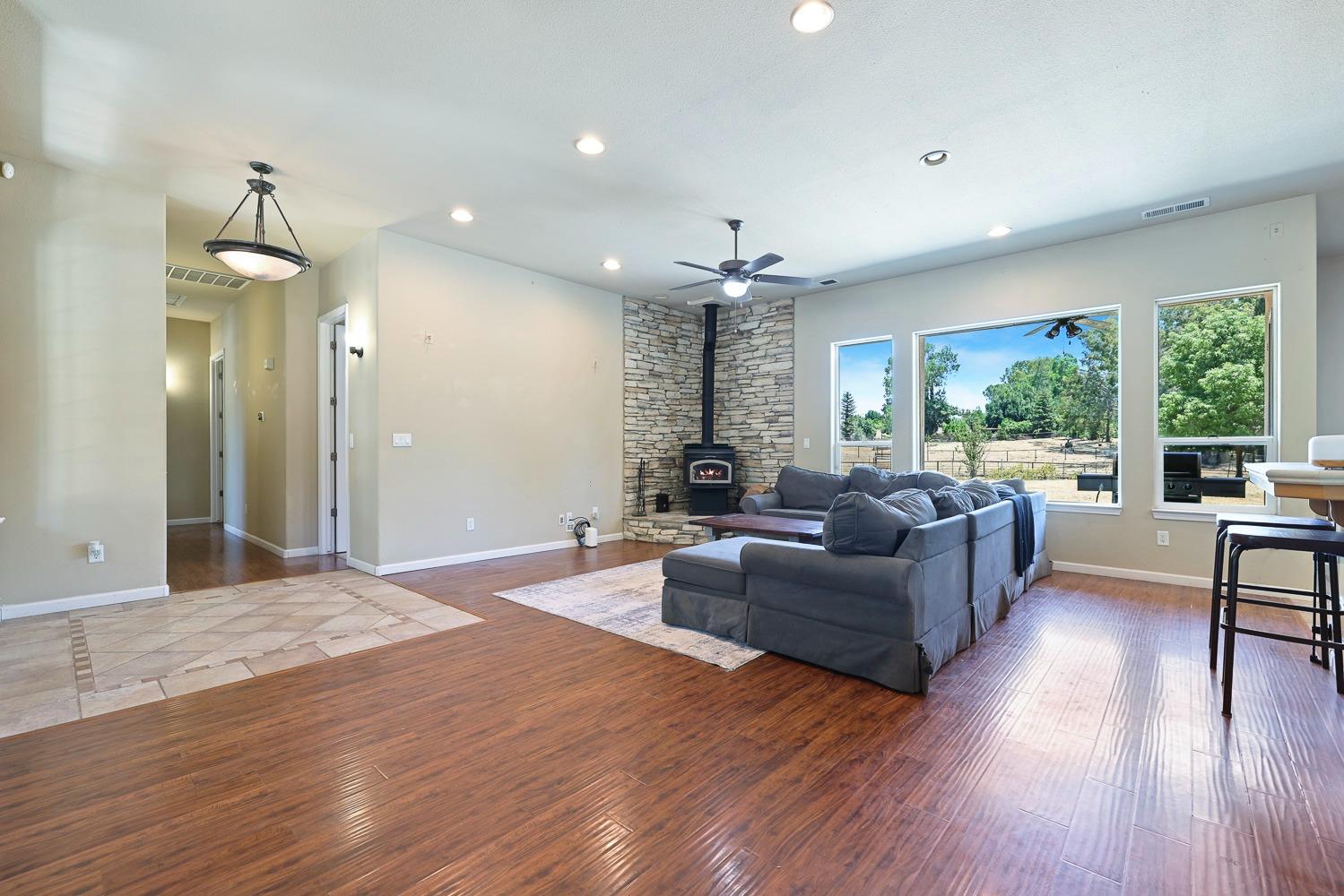 16787 Monreal Road Madera, CA 93636 - Photo 6 of 35 a living room with furniture and a large window