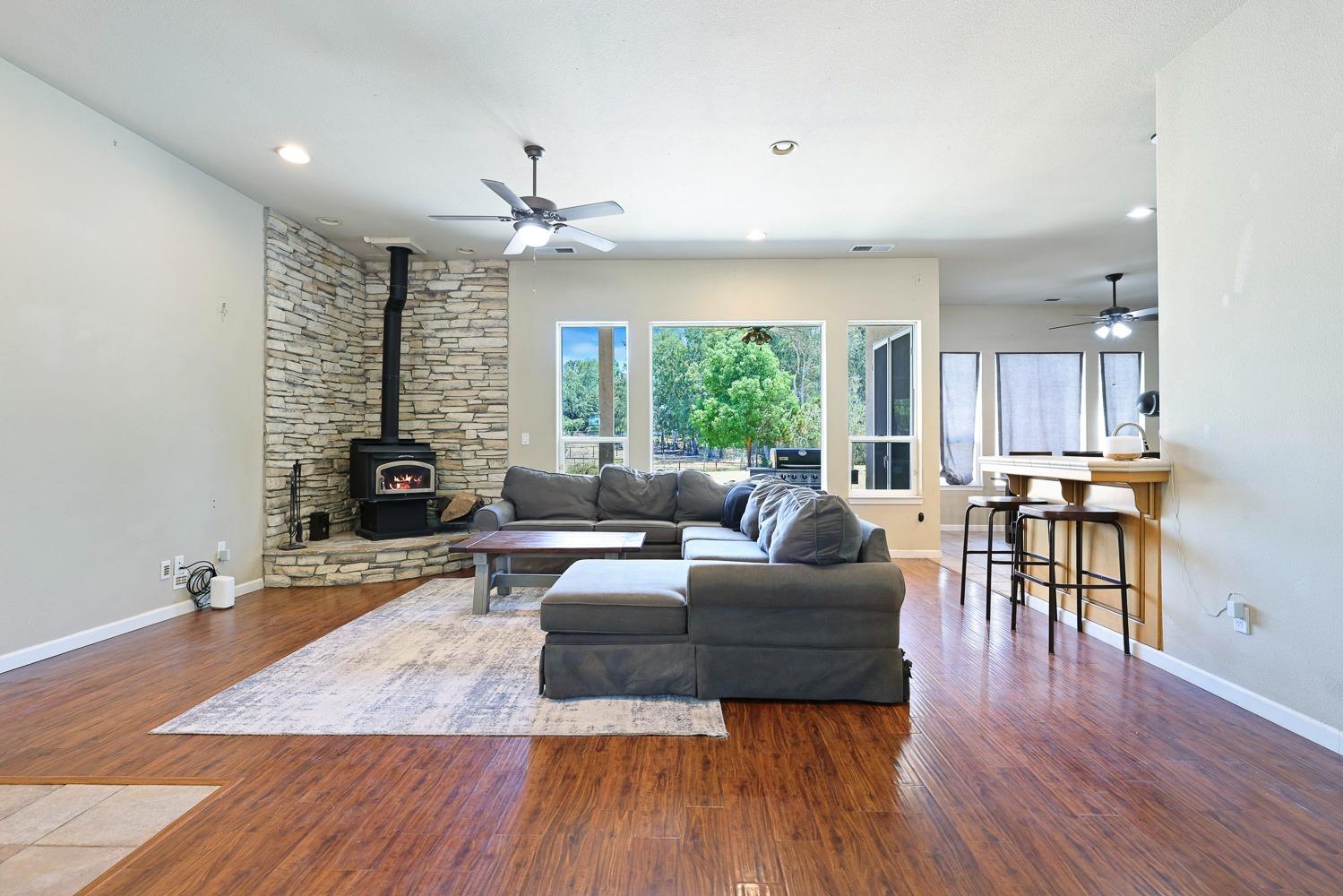 16787 Monreal Road Madera, CA 93636 - Photo 7 of 35 a living room with furniture and a wooden floor