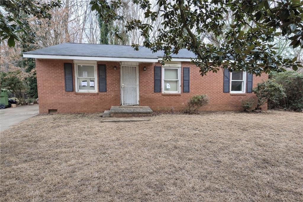 334 Argus Circle Northwest Atlanta, GA 30331 - Photo 13 of 14 a front view of house with yard and trees