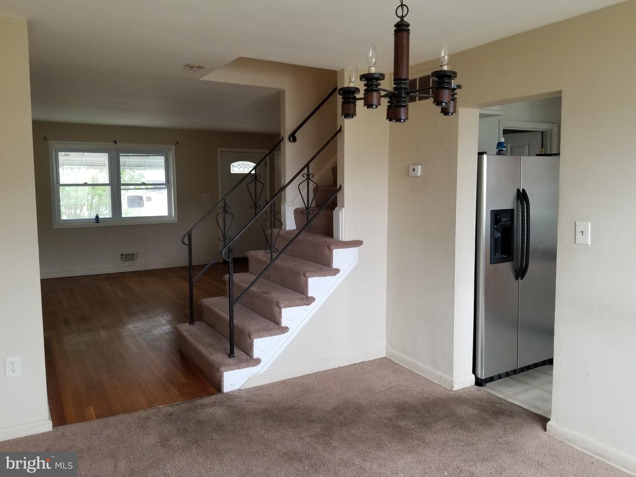 9750 Conmar Road Baltimore, MD 21220 - Photo 7 of 20 a view of a livingroom with a staircase