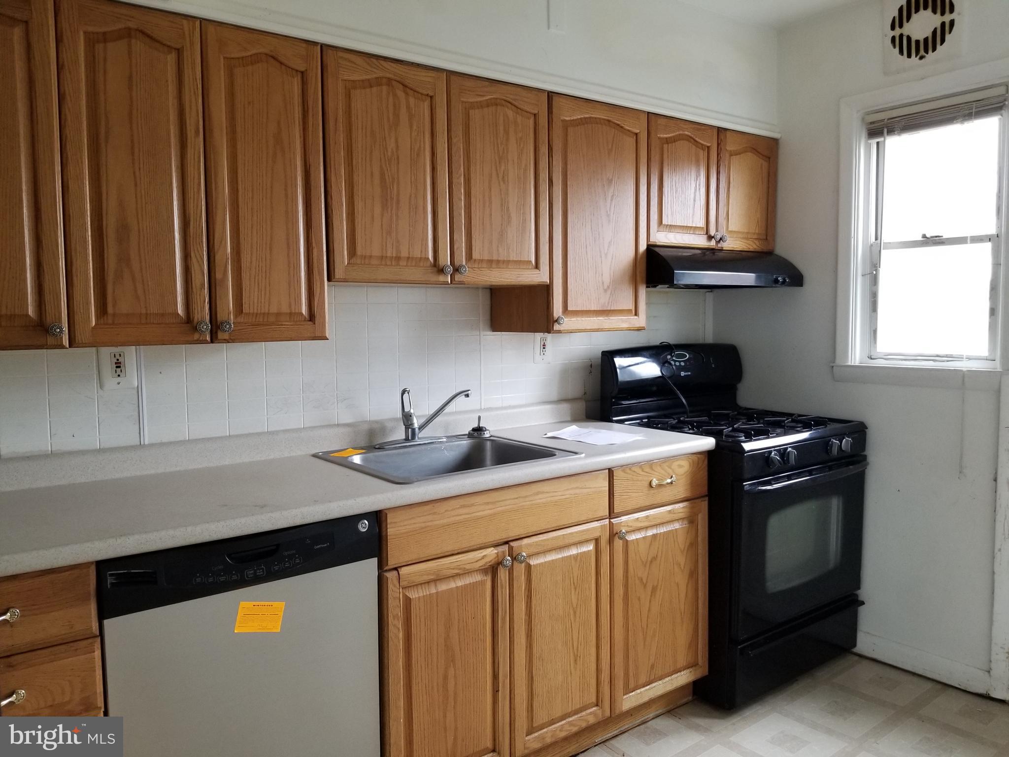 9750 Conmar Road Baltimore, MD 21220 - Photo 8 of 20 a kitchen with stainless steel appliances granite countertop a sink stove and cabinets