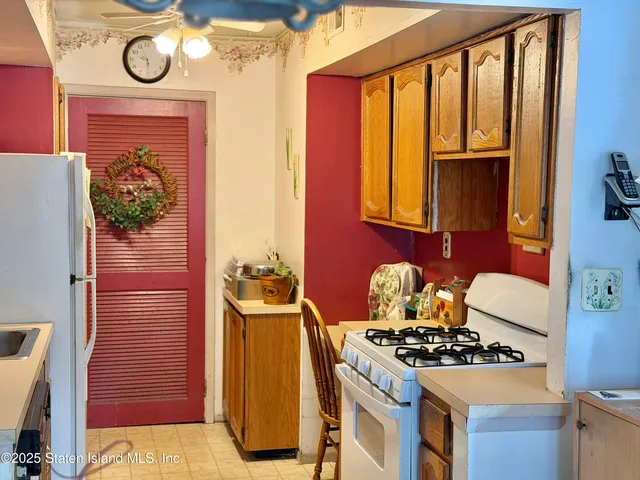 a kitchen with a stove and a refrigerator