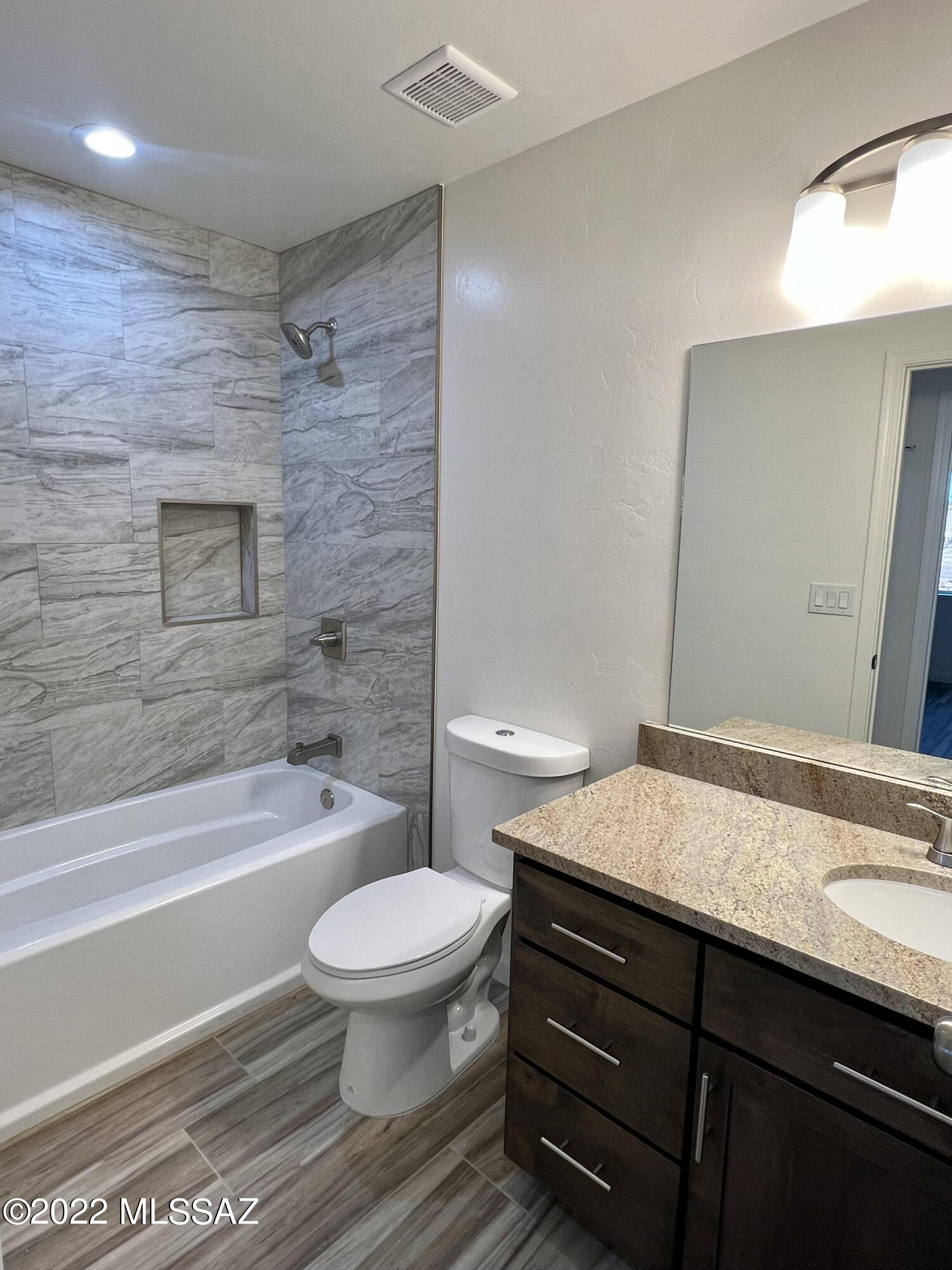 105 Headge Court Rio Rico, AZ 85648 - Photo 17 of 27 a bathroom with a sink a toilet and a bathtub