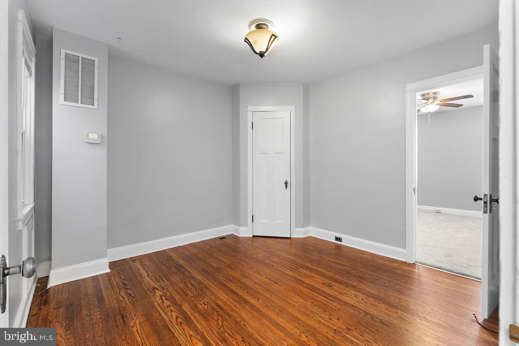 339 Drew Street Baltimore, MD 21224 - Photo 14 of 26 a view of empty room with wooden floor