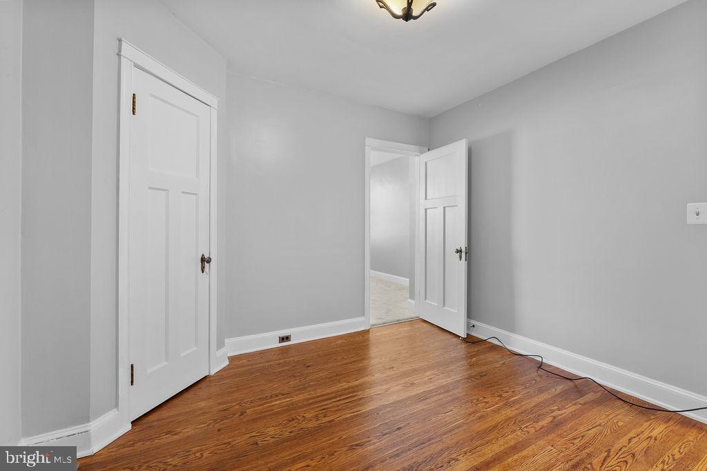 339 Drew Street Baltimore, MD 21224 - Photo 17 of 26 a view of wooden floor and windows in a room