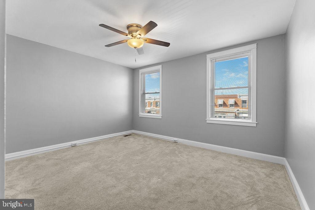 339 Drew Street Baltimore, MD 21224 - Photo 19 of 26 a view of an empty room with a window