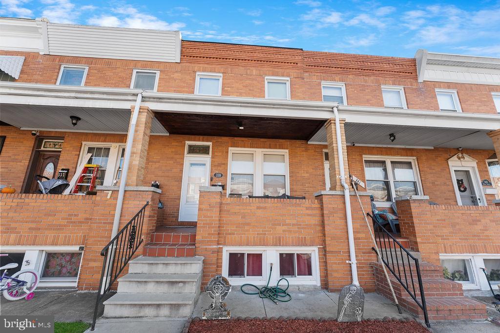 339 Drew Street Baltimore, MD 21224 - Photo 4 of 26 a front view of a building with glass windows