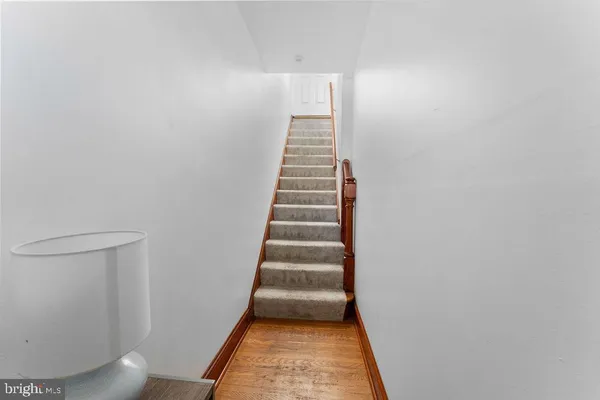 a view of a hallway with stairs