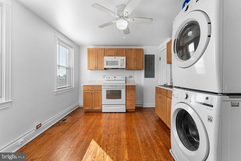339 Drew Street Baltimore, MD 21224 - Photo 7 of 26 a view of a livingroom with washer and dryer