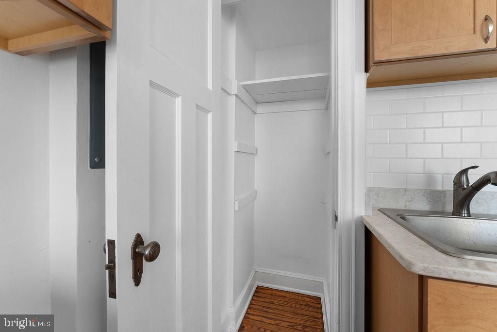 339 Drew Street Baltimore, MD 21224 - Photo 10 of 26 a bathroom with a sink and mirror