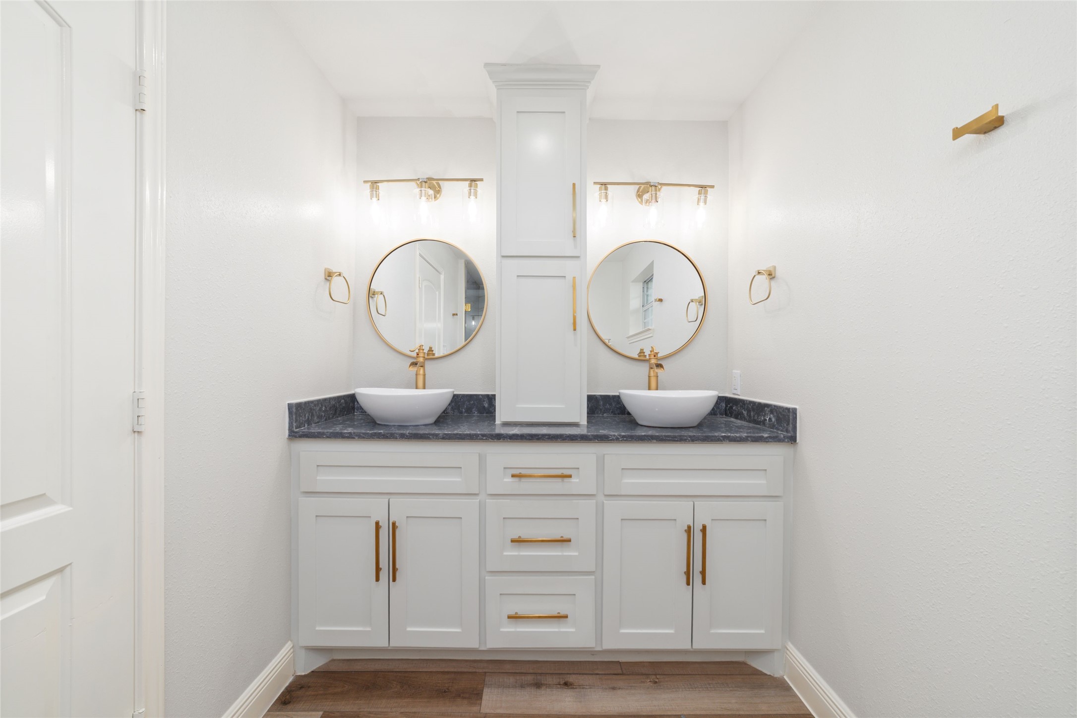 5922 Hummingbird Street Houston, TX 77096 - Photo 16 of 26 The beautifully renovated primary bathroom with dual sinks pairs timeless finishes with everyday comfort. A spacious double vanity provides plenty of room to start and end your day with ease.