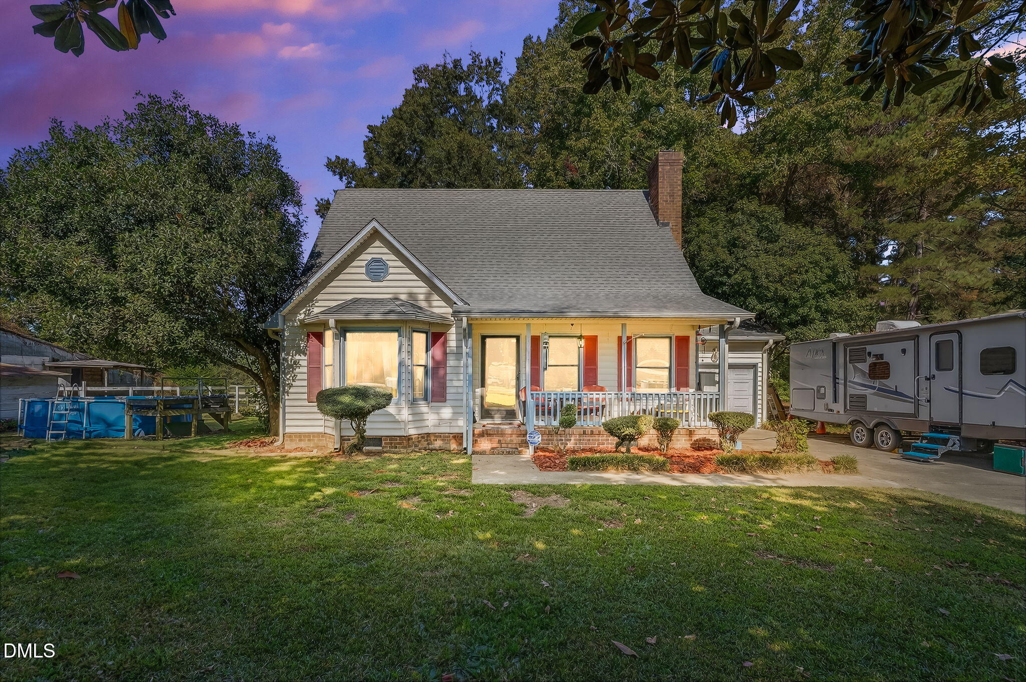 350 Grantham School Road Goldsboro, NC 27530 - Photo 2 of 54 a backyard of a house with table and chairs