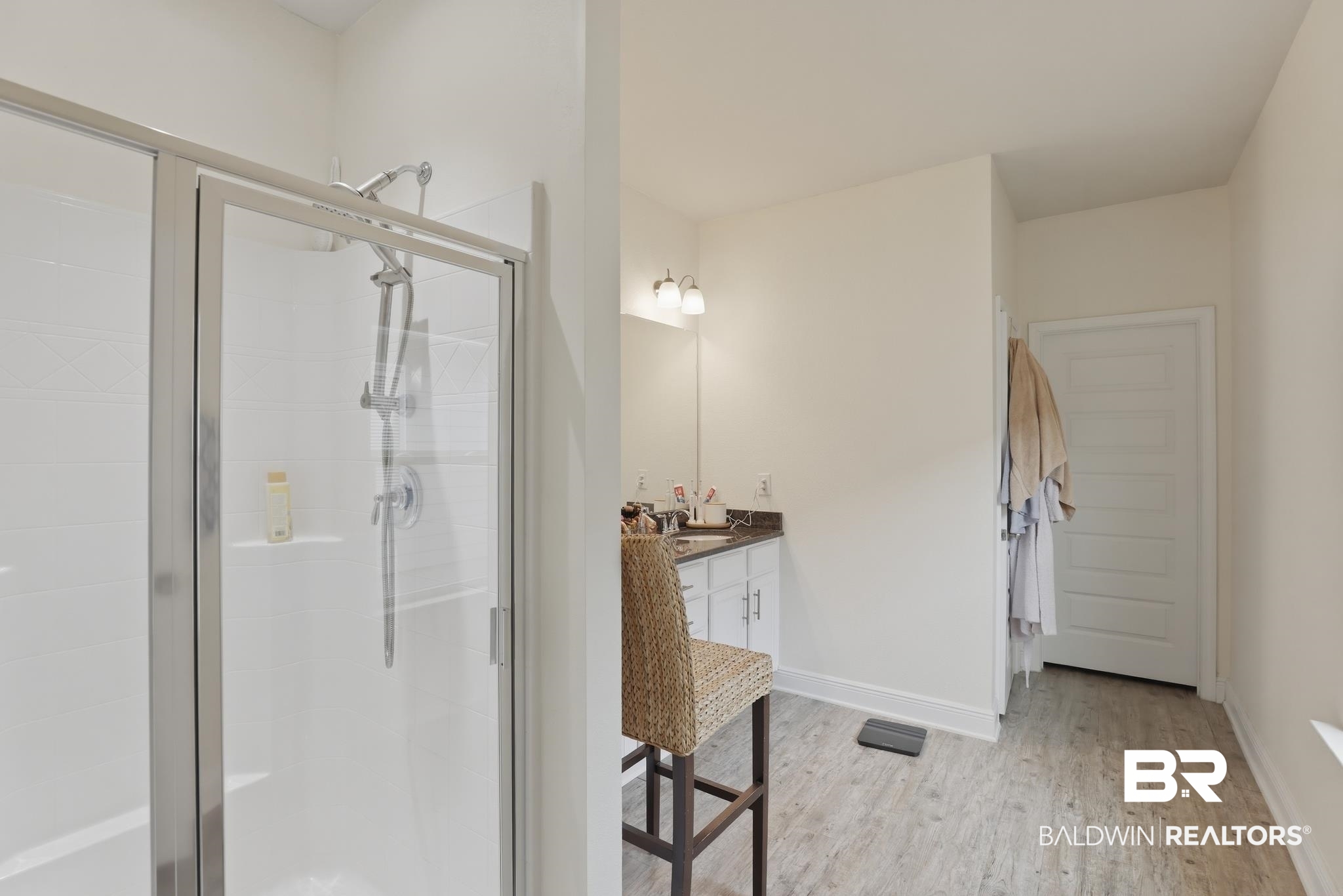 1210 Primrose Lane Foley, AL 36535 - Photo 15 of 33 Glass-enclosed shower with a handheld showerhead and built-in shelving