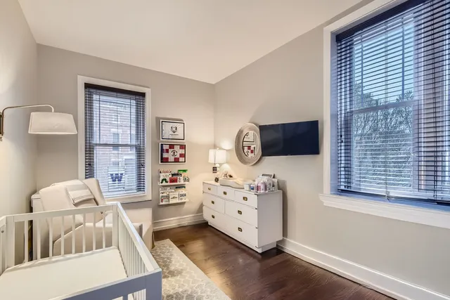 a bathroom with a sink vanity mirror and toilet
