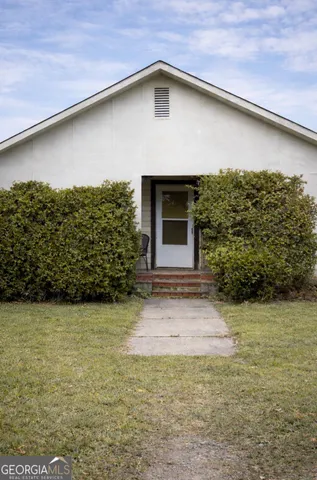 a backyard of a house with lots of green space