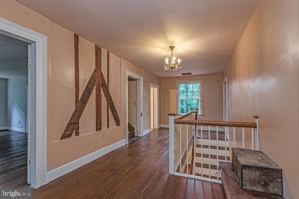 807 Holly Corner Road Fredericksburg, VA 22406 - Photo 19 of 57 a view of a hallway with wooden floor and entryway