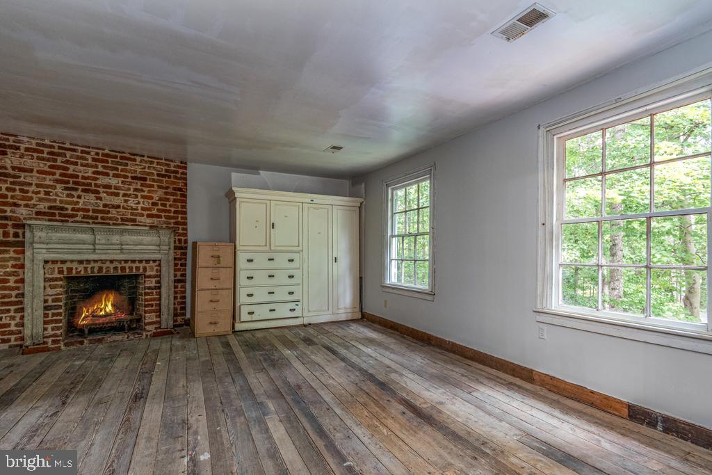 807 Holly Corner Road Fredericksburg, VA 22406 - Photo 20 of 57 a view of an empty room with window and fire place